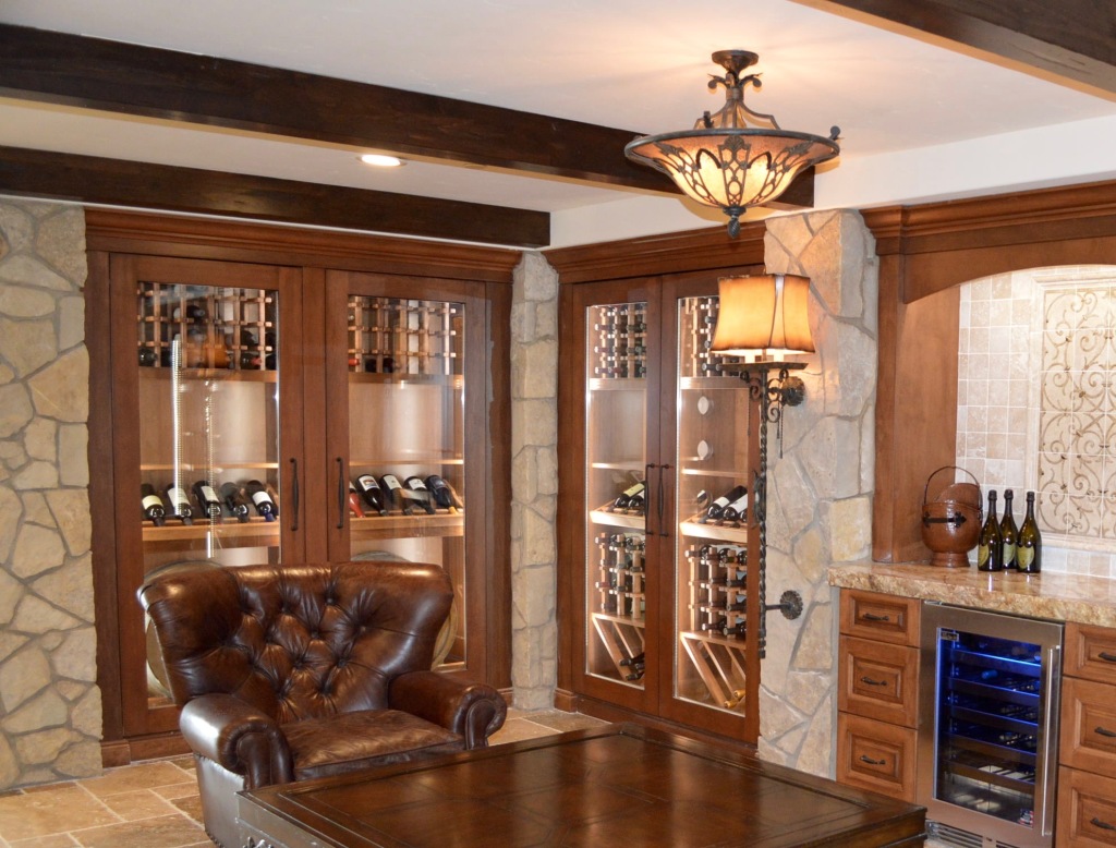 These four reach-in style custom wine cabinets are each sealed by a glass door. There is limited space inside to vent air in and out. 